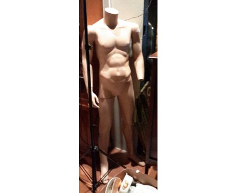 A pink flesh tone male mannequin