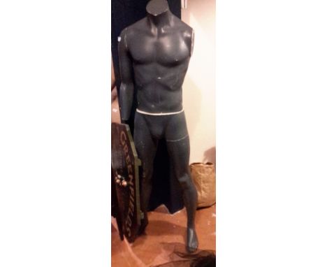 A dark grey male mannequin