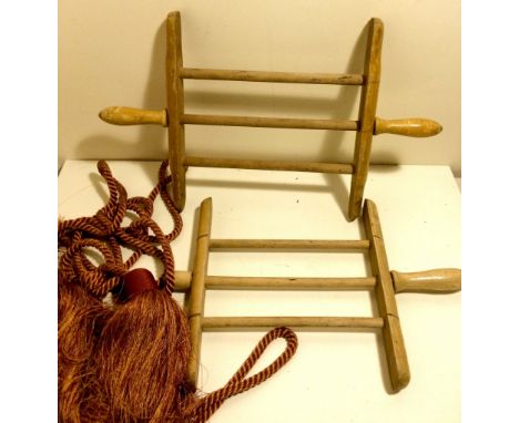 Yarn or wool winders plus a pair of curtain tie backs.