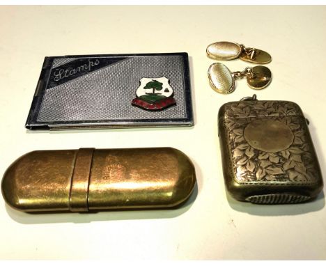 A lighter, vesta case, cuff links and stamp case. (4)