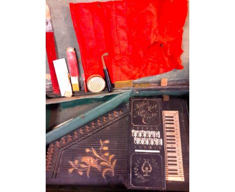 An original auto harp in original case. working but in need of restoration.