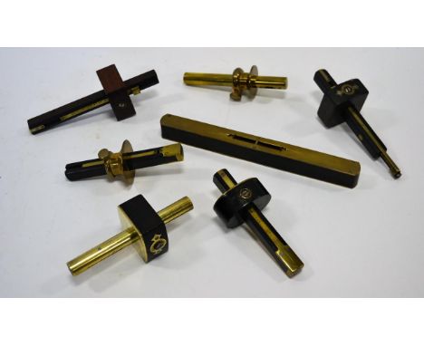 Mortice Gauges various examples in brass/woods, one stamped 'Marsden'; together with a brass and ebony spirit level