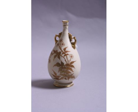 A ROYAL WORCESTER TWIN HANDLED BUD VASE, No.935, gilt floral decoration on cream ground, puce factory mark, height approximat