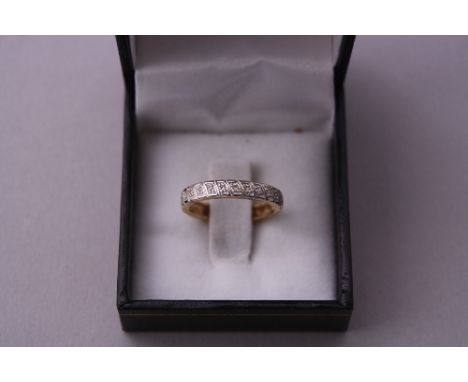 A 9CT GOLD DIAMOND BAND RING, with diamond chips to the full band, hallmarks for Birmingham, ring size M