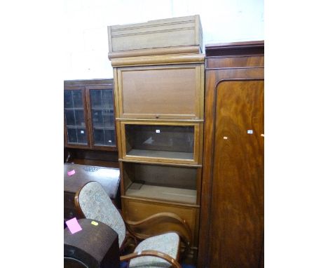 A LIGHT OAK PART GLAZED FOUR SECTION BOOKCASE/CABINET, with drawer below, etc, approximate size width 80cm x depth 37cm x hei