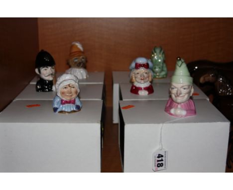 A SET OF SIX BOXED ROYAL WORCESTER LIMITED EDITION CANDLE SNUFFERS FROM PUNCH AND JUDY SERIES, to include 'Toby' RW4878, 'Cro