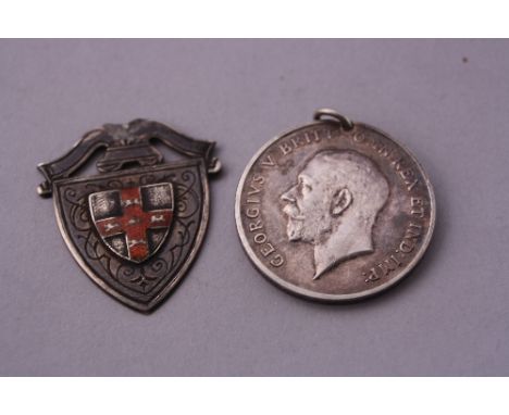 A 1914-18 MEDAL, to Pte H.J. Jonas, Duke of Cornwall Light Infantry and a silver badge (2)