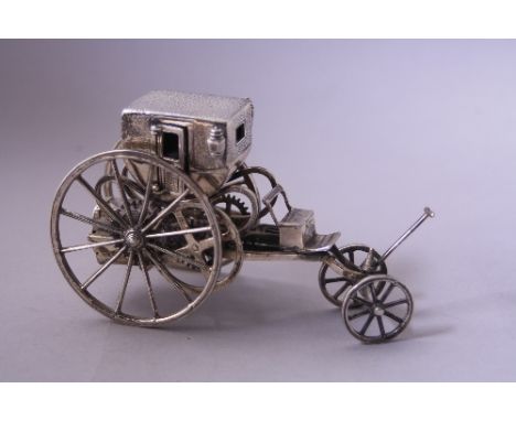A SILVER MOUNTED MECHANICAL CARRIAGE, stamped 925 Medusa under, approximately 13.5cm x 8cm high, 9ozt