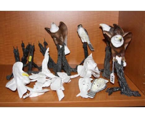 A GROUP OF UNFINISHED ROYAL WORCESTER BIRD OF PREY ORNAMENTS, to include stands and other bird stands