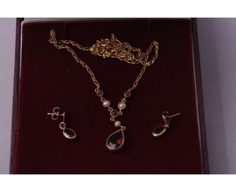 A 9CT GOLD GARNET AND PEARL NECKLACE, together with a pair of garnet ear pendants, hallmarks for London