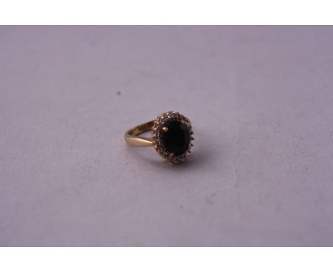 A 9CT DIAMOND AND SAPPHIRE DRESS RING, ring size K