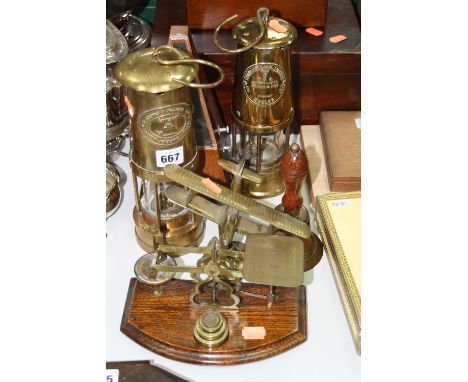 E THOMAS & WILLIAMS CAMBRIAN NO.133110 LAMP, Eccles Protector lamp, metronome, weights and scales, brass model aeroplane on s
