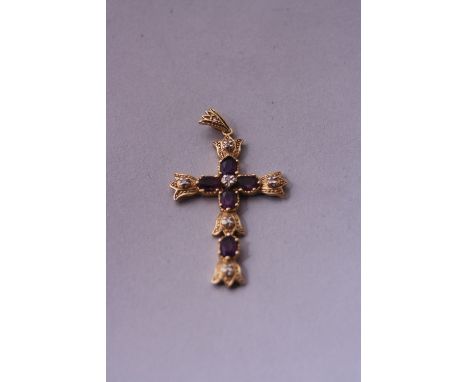 A 14CT GOLD DIAMOND AND AMETHYST CROSS
