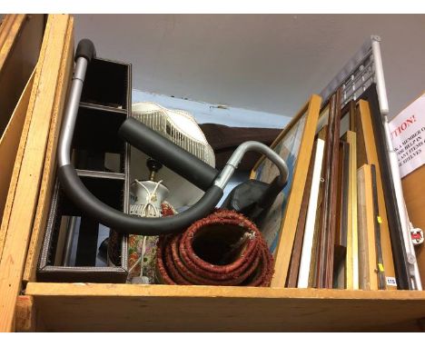 Shelf of assorted, prints, rug etc.