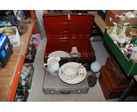 Two metal trunks, chamber pot, Tilley lamp, bedroom ware jugs/bowls, lamps etc. and 2 other cases.