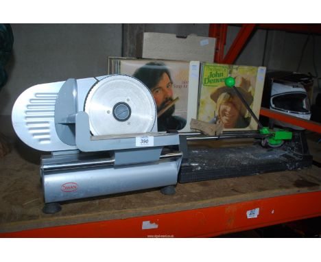 A meat slicer and a tile cutter.