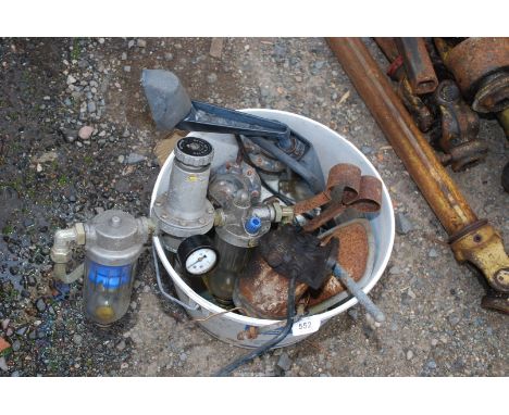 A bucket containing; hydraulic jack, mirrors, tractor fuel lift pumps, etc.