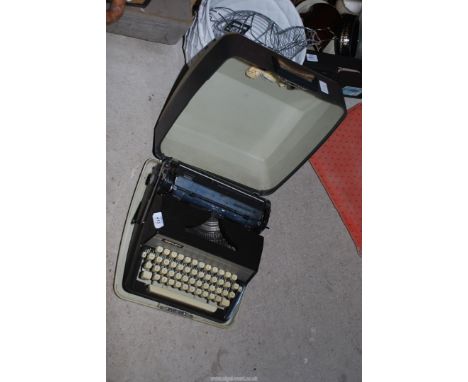 A cased Adler Gabriele 30 typewriter.