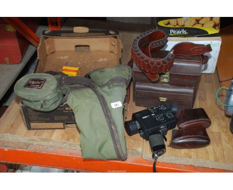 A soft Webley gun sling, Eumig cine camera, gun stock pads and cartridge gun belt.