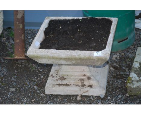 A square concrete planter 24'' x 12'' high.