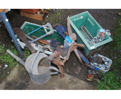 Two plastic containers, Stilsons, blow lamp, clamp on vice, galvanised watering can, etc.