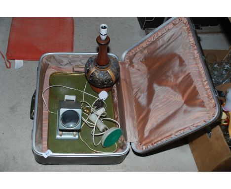 A suitcase containing onyx table lamp, slide viewer, tray, etc.