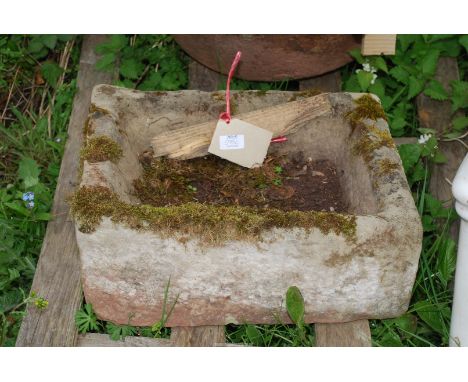 A stone trough 14" wide x 18" deep x 7" tall.