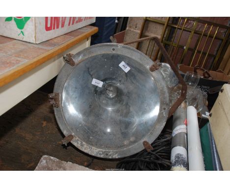 An aluminium cased 240 volt flood light, 17" diameter.