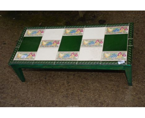 A low tile topped table, 32" wide x 14" deep x 9 1/2" high.