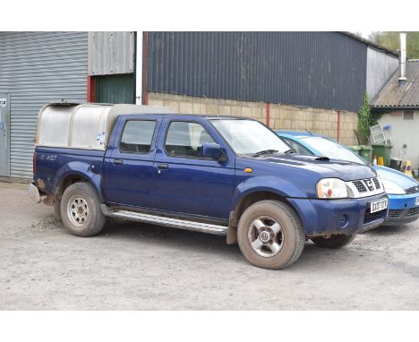 A Nissan Navara 2,498 cc Turbo Intercooled Diesel-engined Crew-Cab Pick-up Truck in dark metallic blue. First registered on t