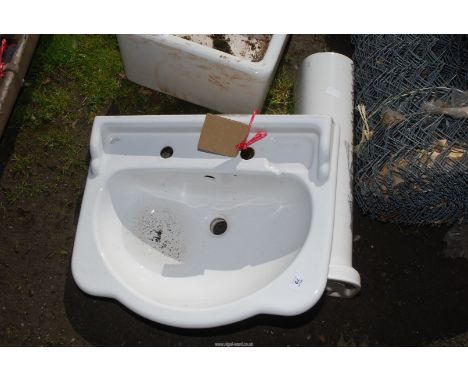 An Ideal Standard hand basin and pedestal.