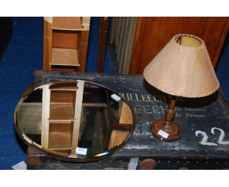 A small table lamp with leaf shade and bevel plate circular mirror.