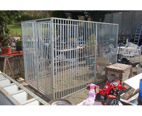 A metal Dog Run, the two sides being made up of four sections, each 48'' wide x 72'' high approx and the one end section incl