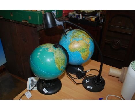 A 'Serious Readers' black reading lamp and two globes, one globe being illuminated.