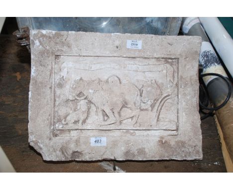 A concrete tile with 'God Speed The Plough'.