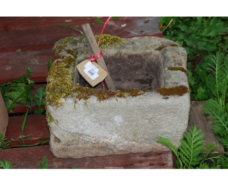 A stone planter 13 1/2" x 10" x 8 1/2" deep.