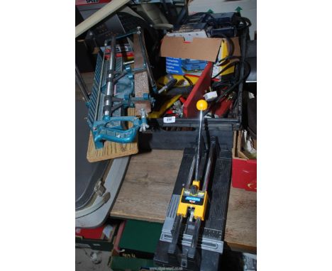 A tile cutter, Clarke jigsaw, Clarke 4 1/2" angle grinder, etc.