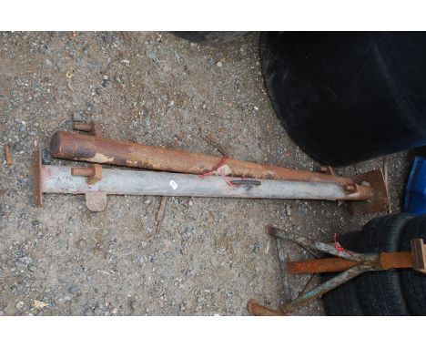 A pair of tubular gate posts 75 1/2" and 70 1/2" with hooks on.
