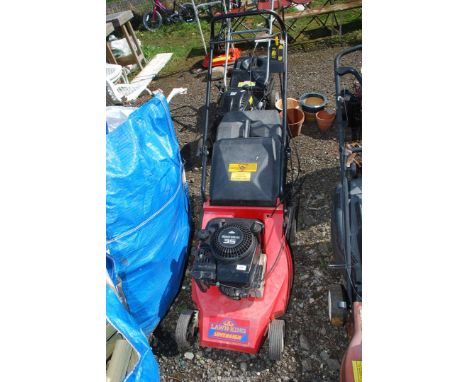 A Lawn King propelled lawn mower - engine turns.