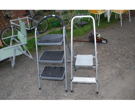 A two rung step ladder and a 3 rung step ladder.