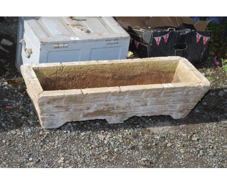 A long concrete planter trough, 32'' wide x 9'' high x 12'' deep.