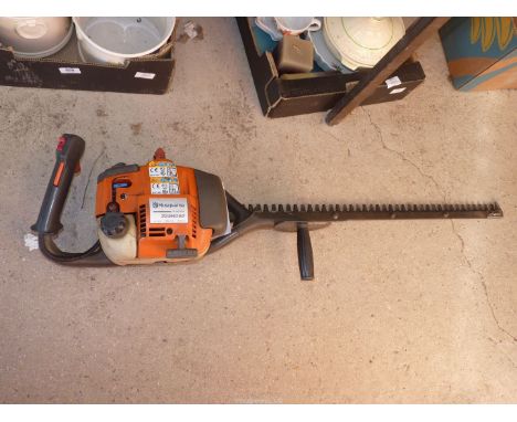 A Husqvarna chainsaw with 26" cutter bar - good compression.