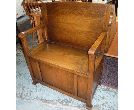 Light oak monks bench with hinged lift up seat and maker's label for Hunter & Smallpage York