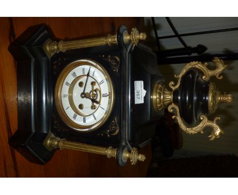 Victorian black marble mantle clock with gilt metal supports and urn crest finial