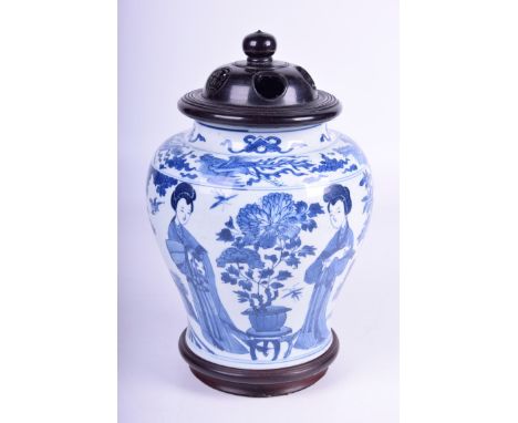 A Chinese blue and white porcelain vase, Kangxi period (1662 - 1722)The baluster form vase decorated in rich cobalt, depictin