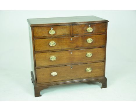An early 19th Century mahogany chest of drawersWith a rectangular moulded top above two short and three long graduated drawer