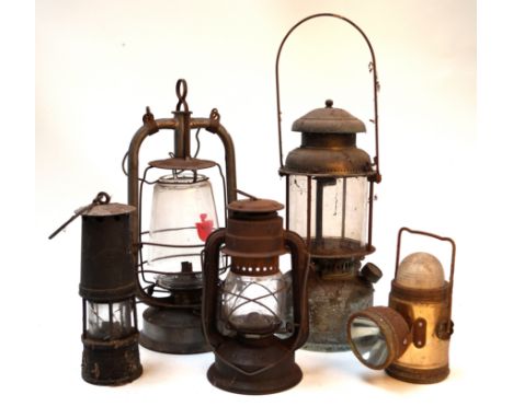 A collection of oil lamps early 20th CenturyTo include a minor's prima lamp and an electric touch (5)