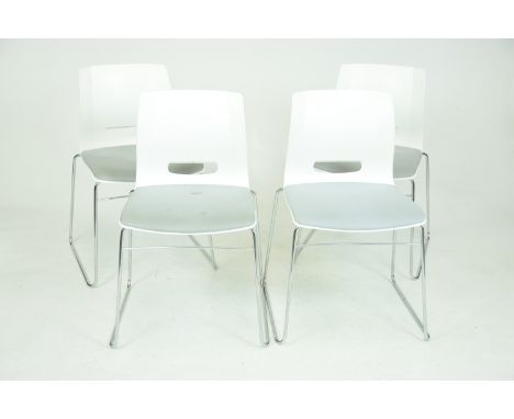 A set of four contemporary Allermuir dining chairsEach with a moulded plastic seat and rear aperture raised on minimalist ste