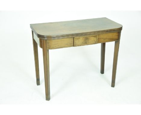 A George III mahogany folding tea tableThe rounded rectangular top with a reeded border above a frieze with a central cross b