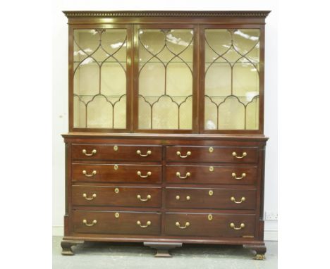 A 19th Century and later mahogany display cabinet on chestThe upper cabinet with a dentil cornice above three beaded and glaz